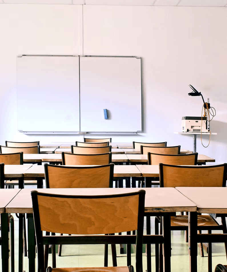 Healthcare training classroom with rows of chairs and a whiteboard